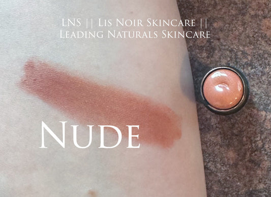 Showing ‘LNS’ ‘Lis Noir Skincare’ ‘Leading Naturals Skincare’ Nude Lipstick and Blush swiped on skin labeled ‘Nude’ under it. Beside the swatch shows the Nude lipstick and Blush in black container.