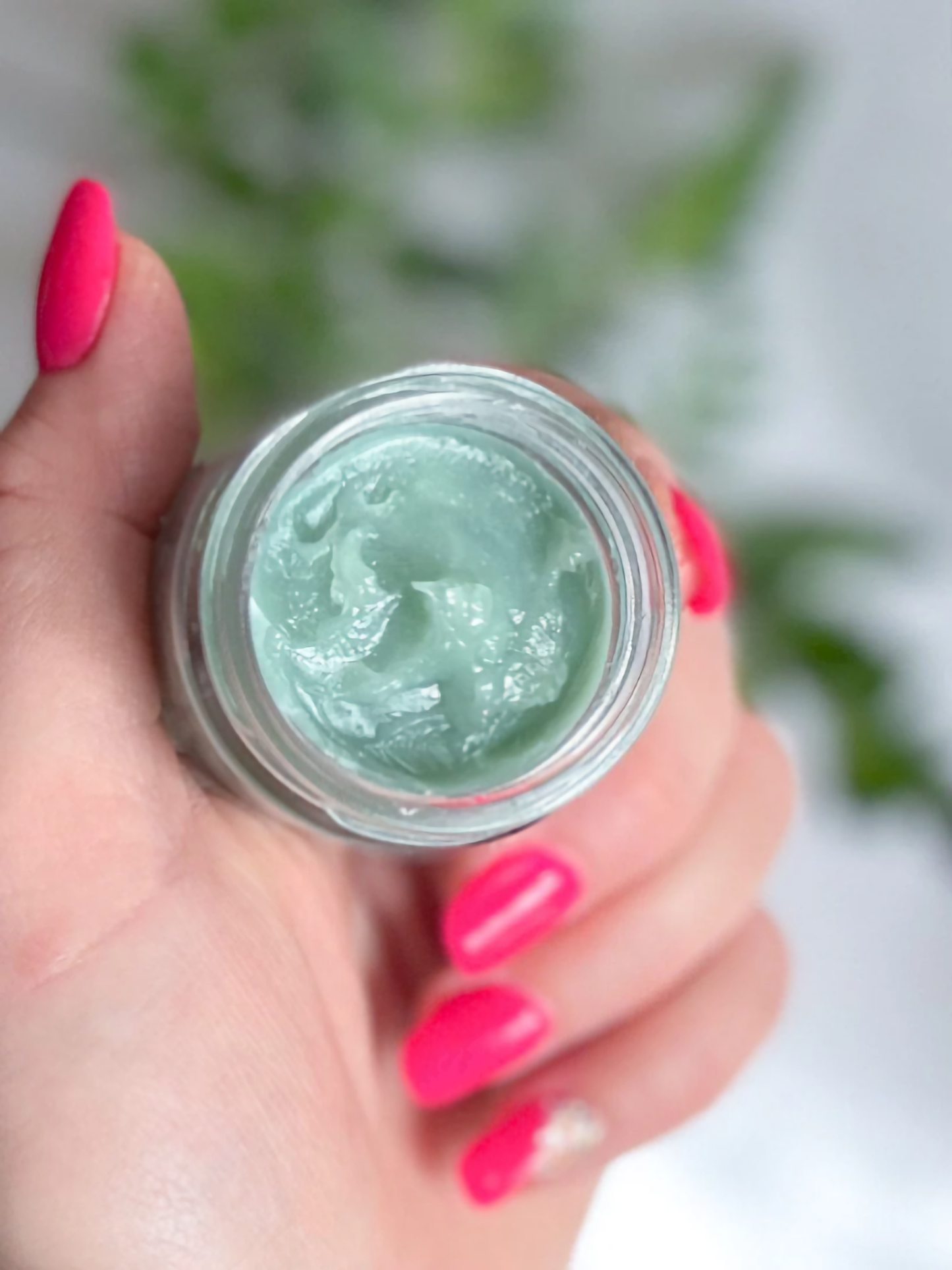 Organic Blue Tansy Cream In Glass Jar in Hand